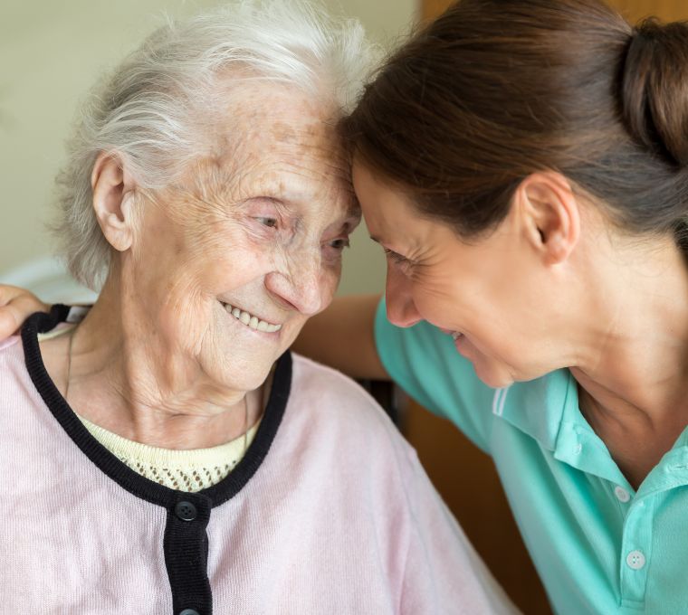 A caregiver embraces a senior client, representing in-home dementia care in Mount Pleasant, SC.