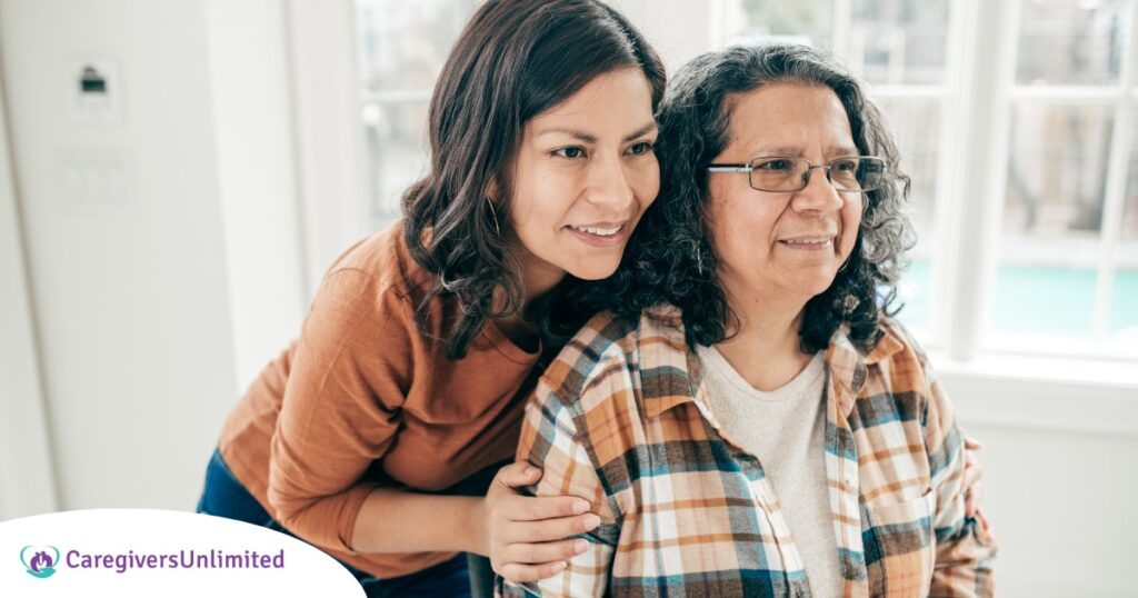 A woman hugs her older mother, representing compassionate senior care.