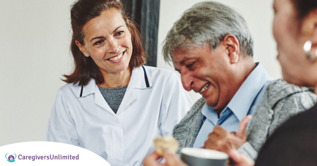 A woman smiles while with clients showing how you can enjoy senior caregiver jobs.