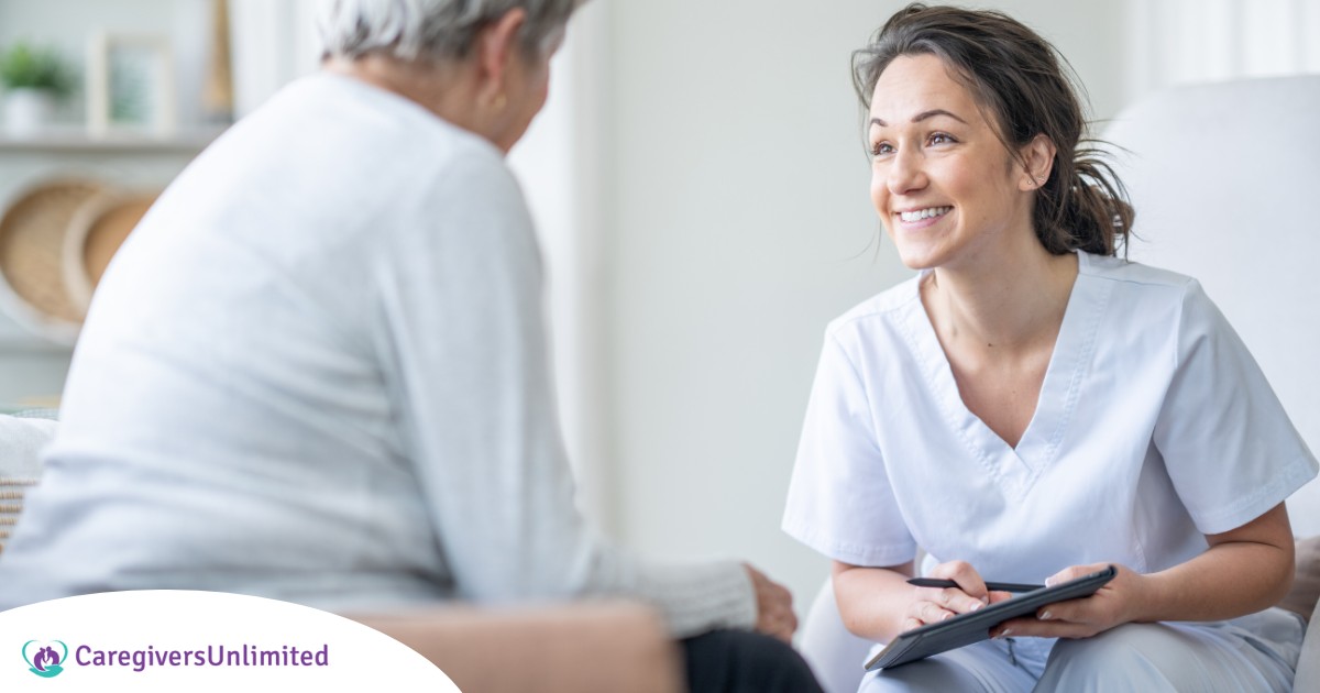 A woman smiles while with a client representing the pros of the home care industry.
