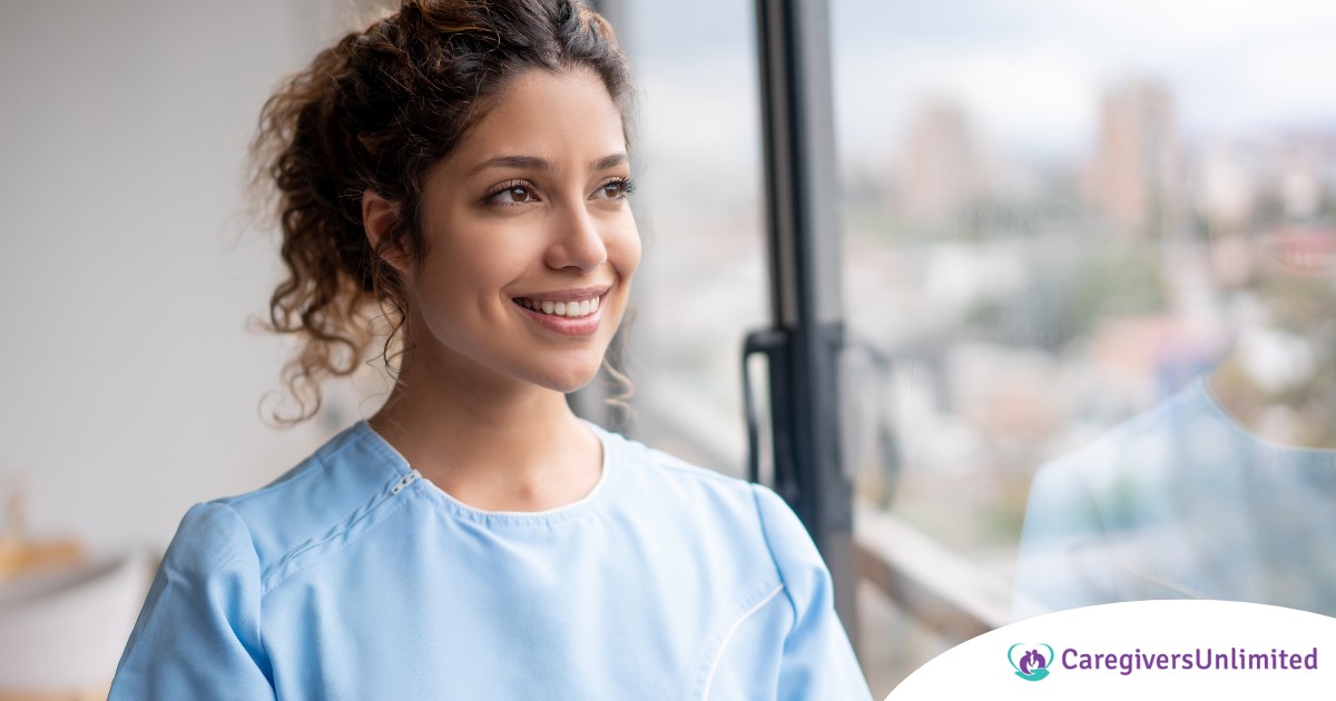 A woman smiles while looking ahead hopefully, showing the positive outlook that planning for a home care career can bring.