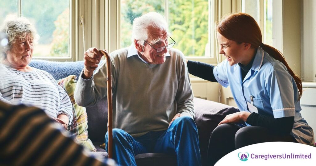 A woman has a good time with her older clients, representing the kind of personal skills needed to be a good caregiver.