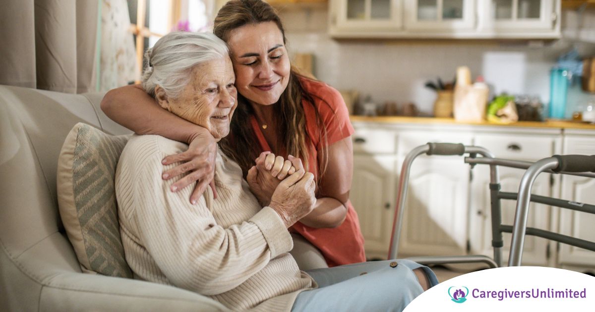 Caregiver supporting an elderly woman in the transition to senior home care