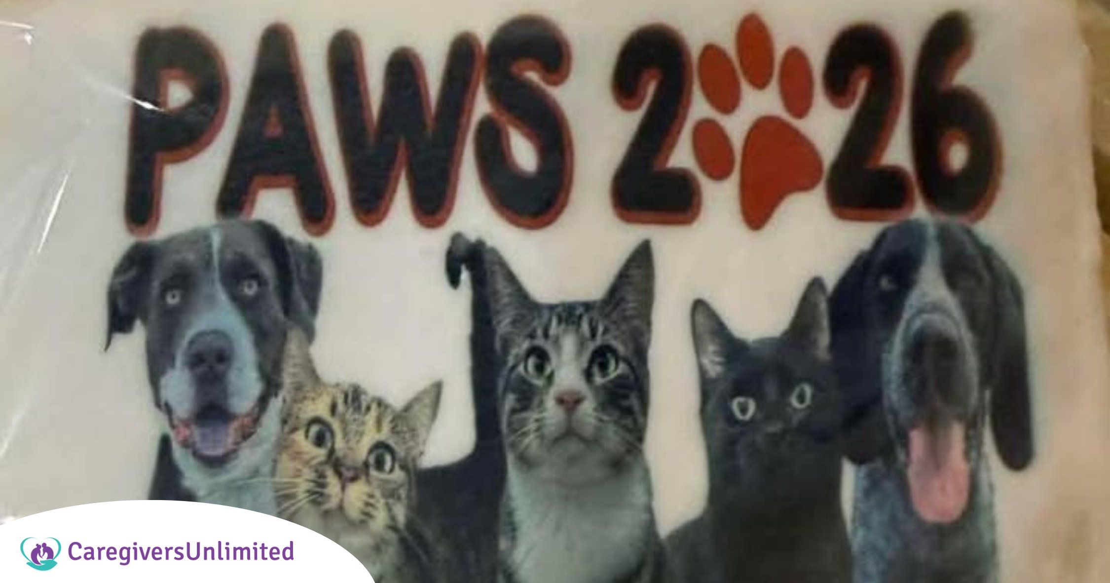 A graphic featuring the text "PAWS 2026" with an orange paw print above a row of five dogs and cats. The Caregivers Unlimited logo is in the bottom left corner.